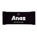 Black chocolate bar packaging with 'Anas' branding on a white background