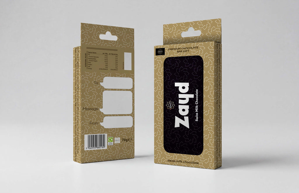 Two views of a cardboard product box for Zayd sour and citrus flavored sweets, shown on a light gray studio background. The front view displays a black window with the white 'Zayd' brand name, while the side view shows product details, a barcode, and a hanging tab.